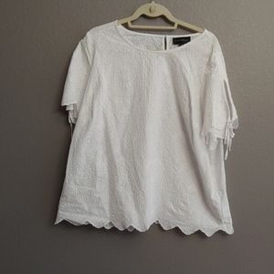 White top with embroidery detail